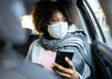 Woman in lyft with mask
